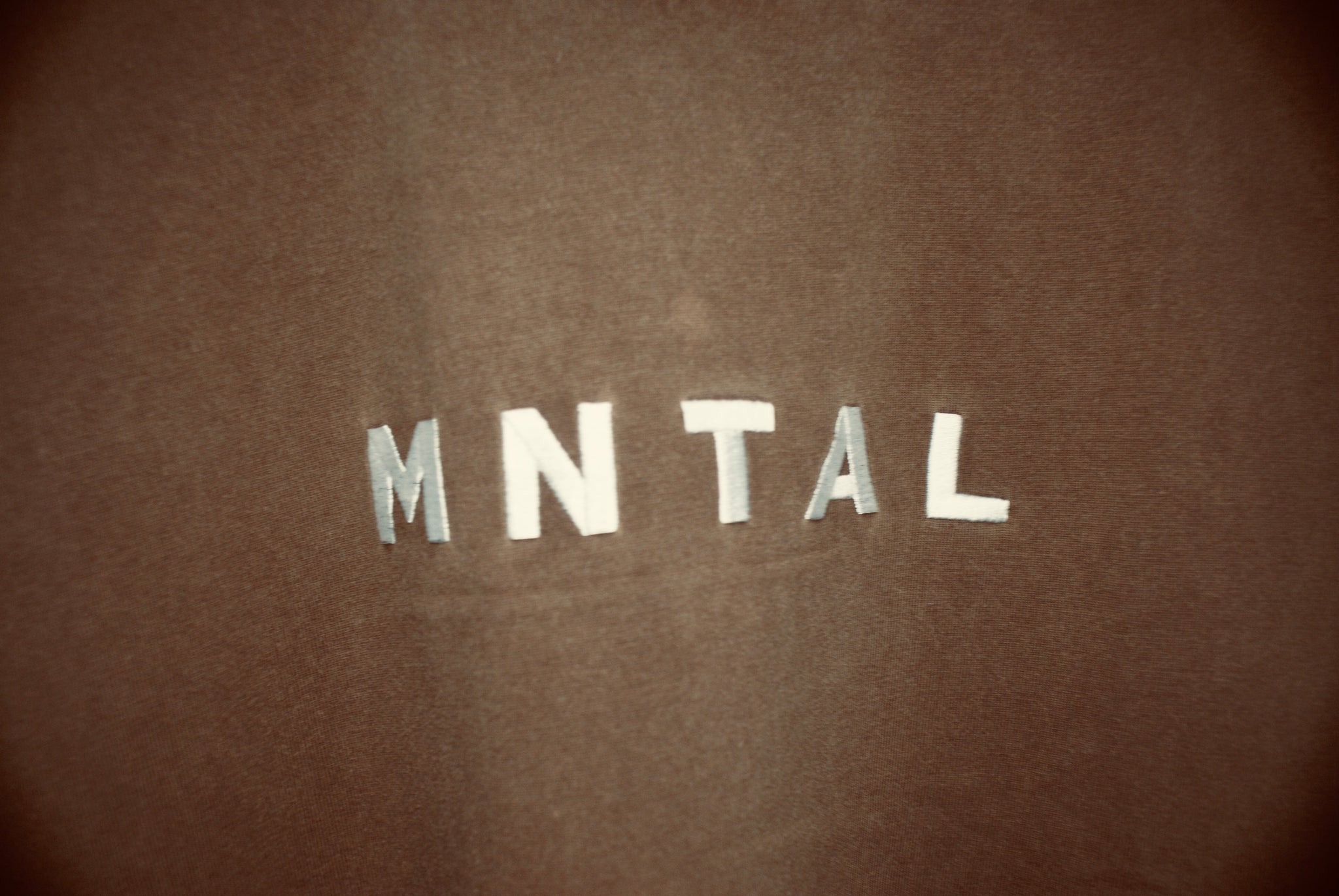 Faded brown vintage-inspired t-shirt by MNTAL